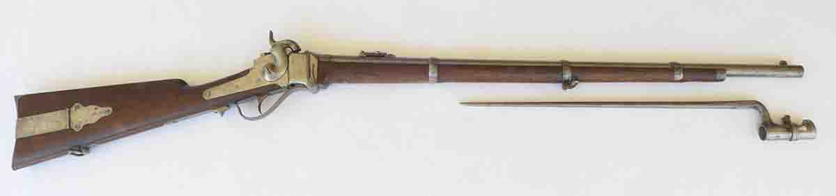 A New Model 1859 Sharps rifle with single trigger and correct Collins & Co. bayonet. It is very worn on the outside like it “saw the elephant,” but is excellent on the inside. The serial number is 39681.